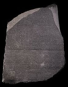 A stone with writing on it in two languages (Egyptian and Greek), using three scripts (hieroglyphic, demotic, and Greek)