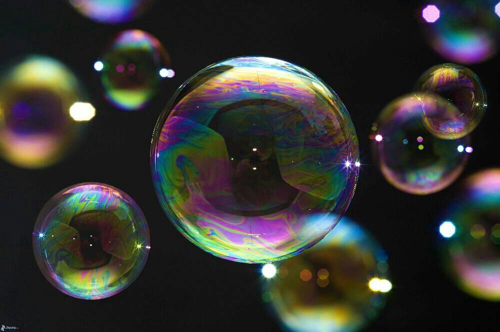blows bubbles