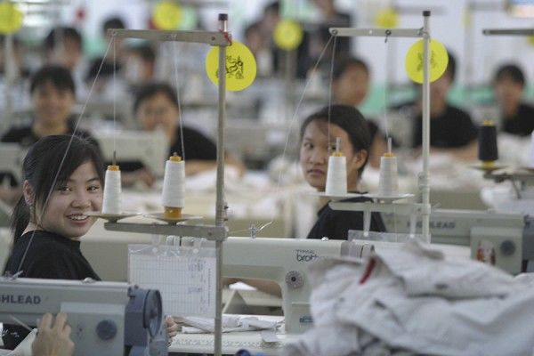 What are the advantages of global manufacturing for developing countries?