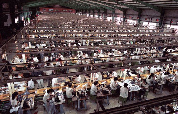 What are the disadvantages of global manufacturing for developing countries?