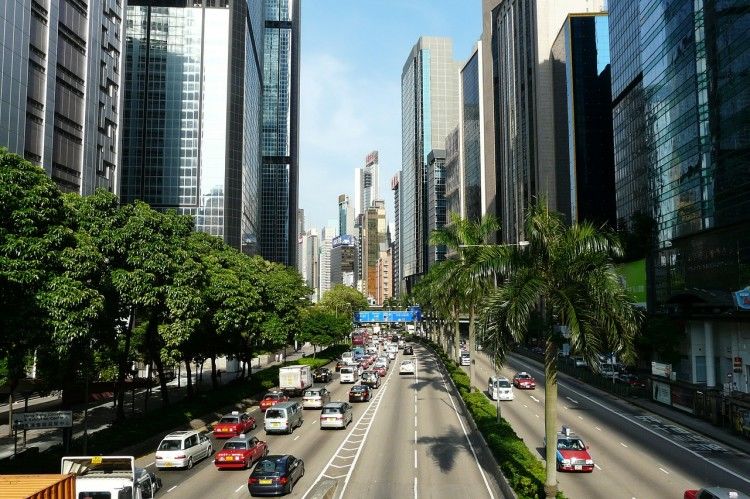 What are the advantages of global manufacturing for developed countries?