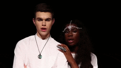 The facial graphic is effective iconography because it: